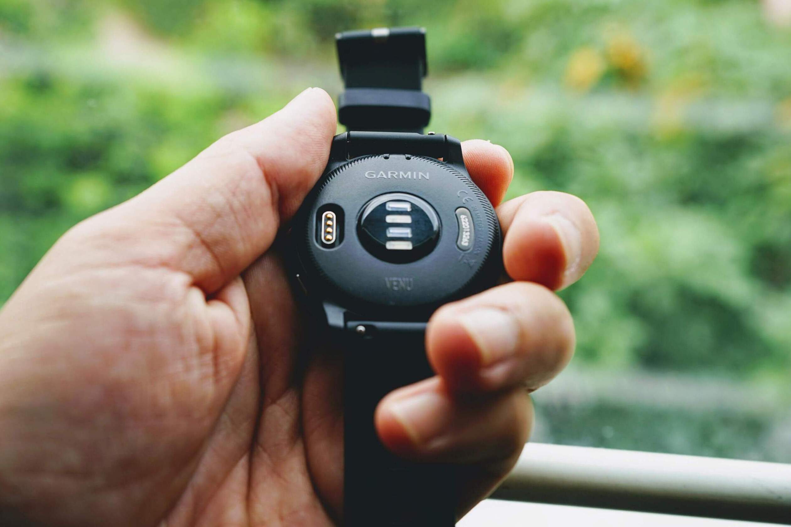 Man holding a Garmin Smartwatch