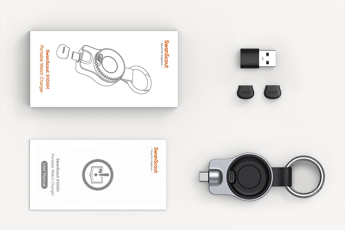 Package contents of SwanScout 510GM including Garmin watch charger main unit USB-C to USB-A converter and silicone protective caps for complete portable charging setup